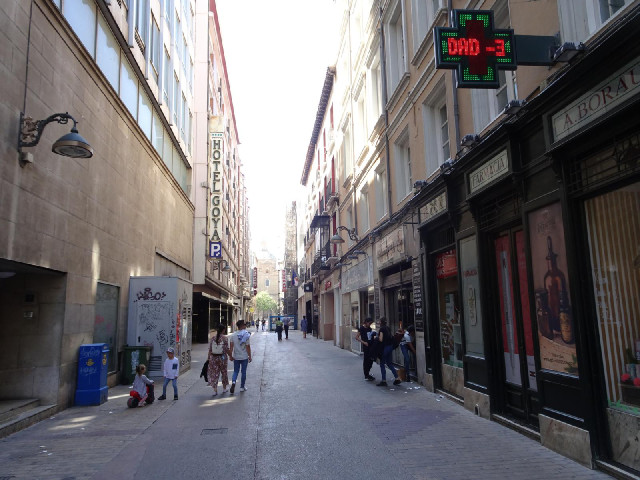 5th of March Street. The people on the right are having some difficulty locking the shutters of thei...