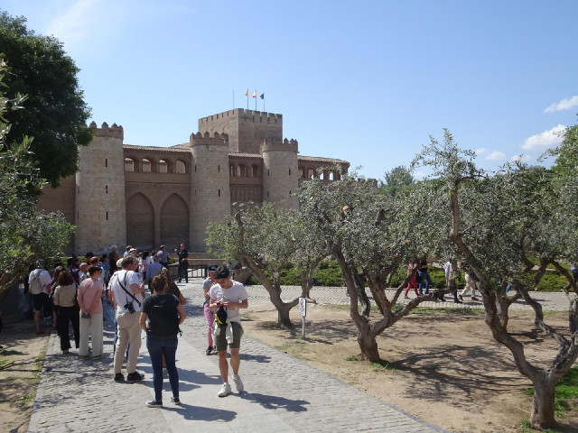 Tourists queueing to enter the Aljafería Palace, which is now the seat of government for the ...