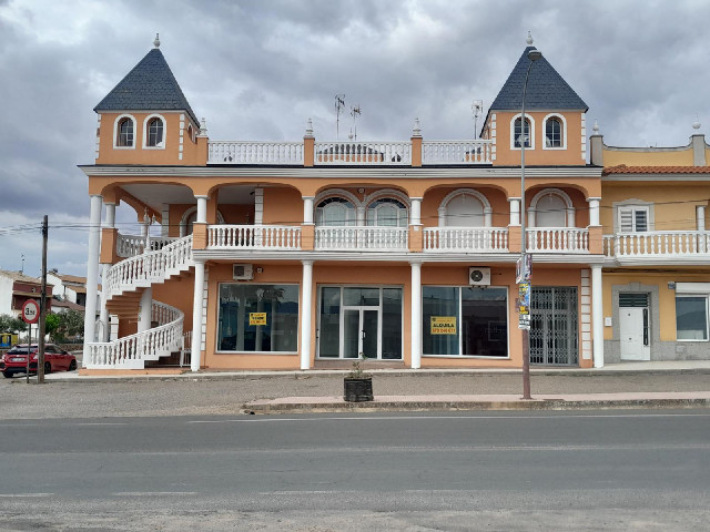 The empty building across the road has an external spiral staircase.