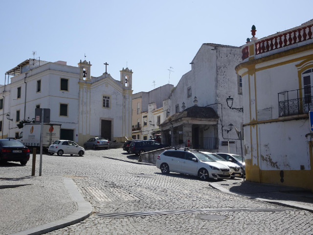 The street name sign is on the right, between the lamp and the balcony. It's not very easy to read b...