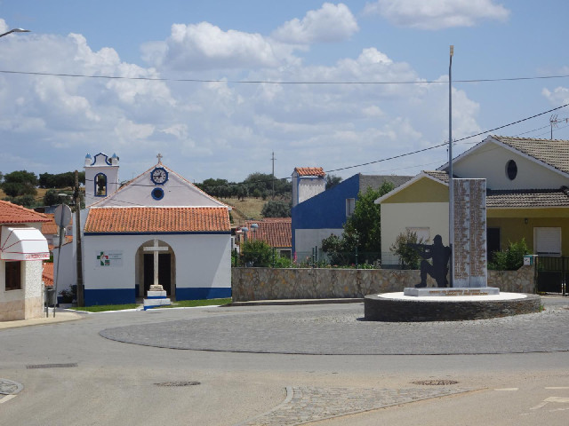 In my next village, Santo Amaro, the sculpture is of a soldier rather than a firefighter, and the cl...