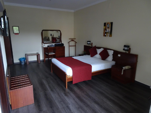 The room is large and quite bare.