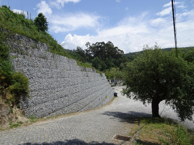 The land is pretty hilly here so constructing a large flat area like a football pitch requires some ...