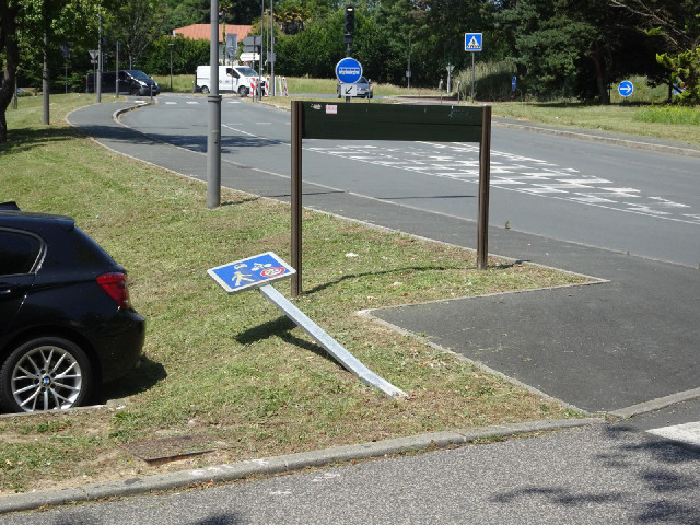 It appears that somebody has driven into the sign telling them to drive cautiously.
