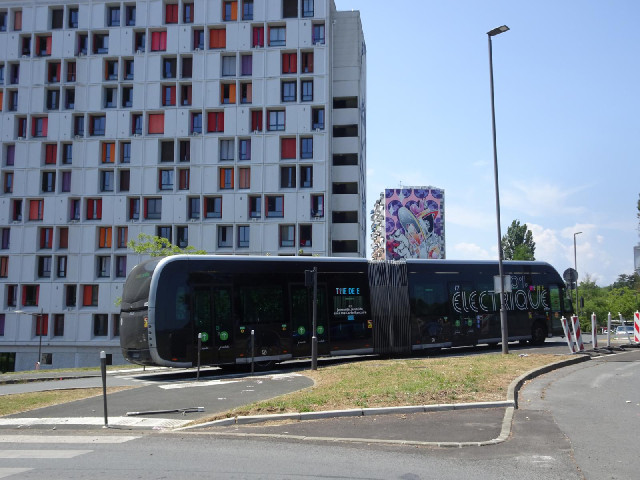 An electric bendy bus and some flats.