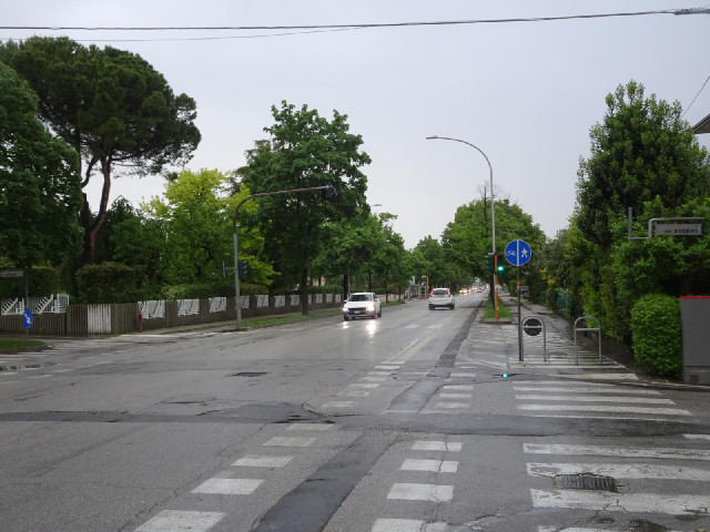 A little further along, this road has a long row of parking spaces and a two-way cycle lane. When pl...