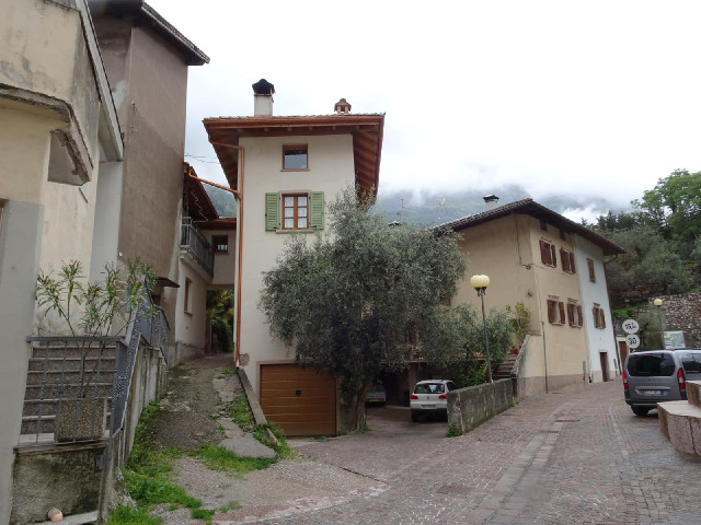 That's a strange house. There's the garage with three more storeys of narrow rooms on top of it, and...