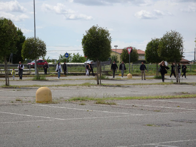 When I was driving, I could see this big growd of people in the distance, walking down the main road...